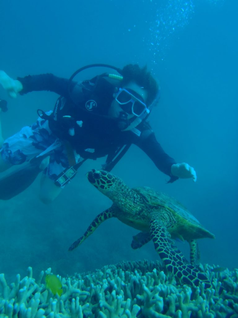 David Simpson diving with a turtle in The Great Barrier Reef. Diving The Great Barrier Reef