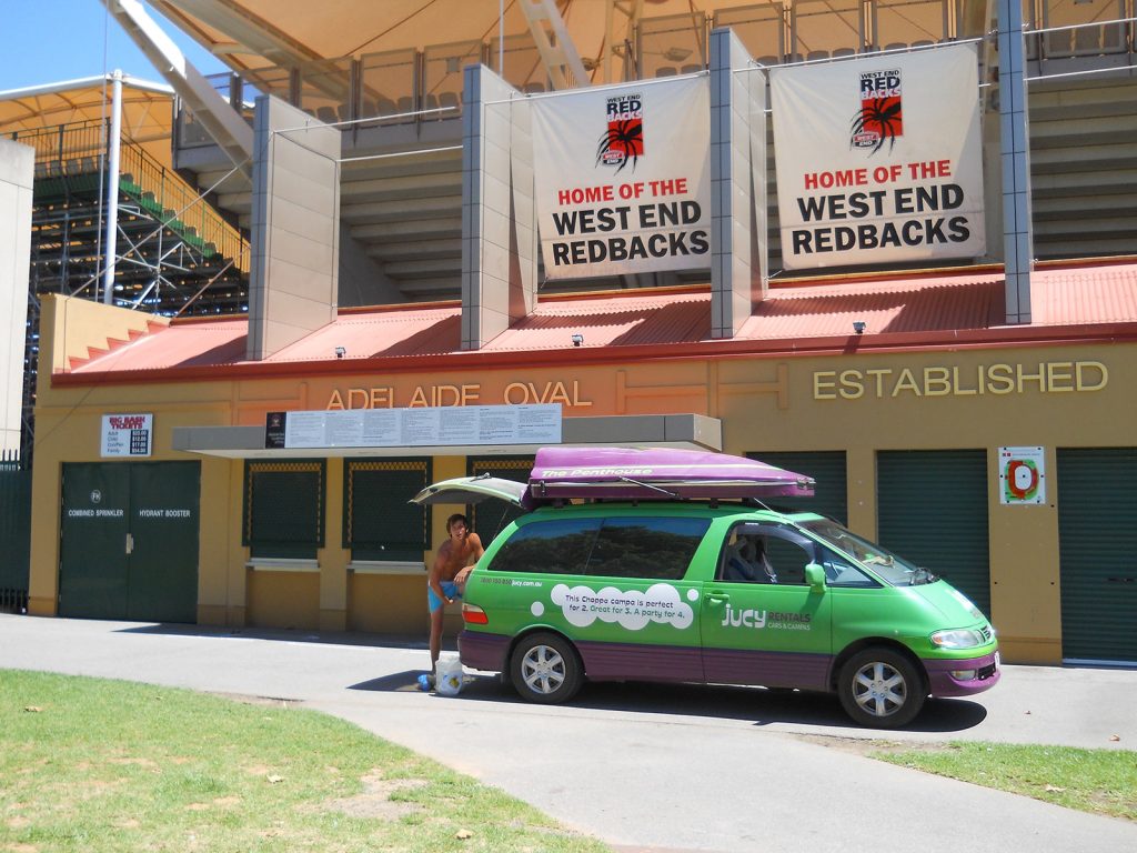 David Simpson and the green rental car at the Adelaide Oval in Australia. Rescued in the middle of the desert