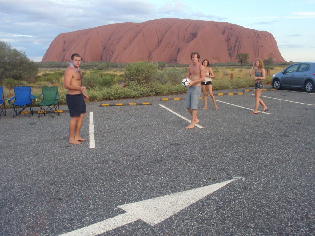 David Simpson and the gang playing soccer near Ayer's Rock in Australia. Rescued in the middle of the desert