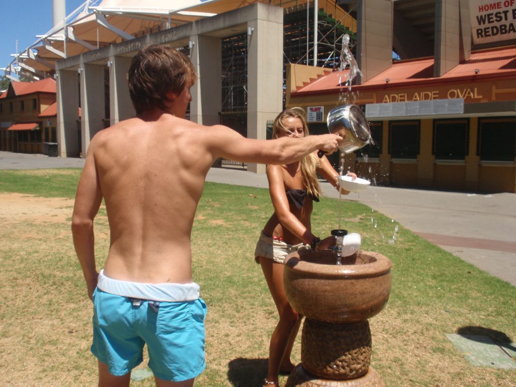 David Simpson with a girl at the Adelaide Oval in Australia. Rescued in the middle of the desert