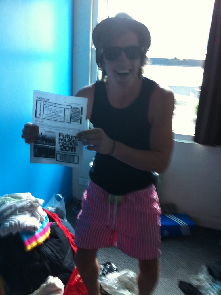 David Simpson holding a Future Music Festival flyer in Melbourne in Australia. Three months of the best in Melbourne