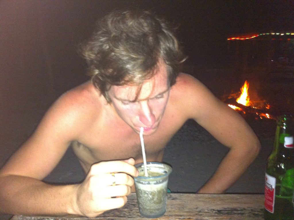 David Simpson drinking beer with straw in Gili T. My first taste of Asia