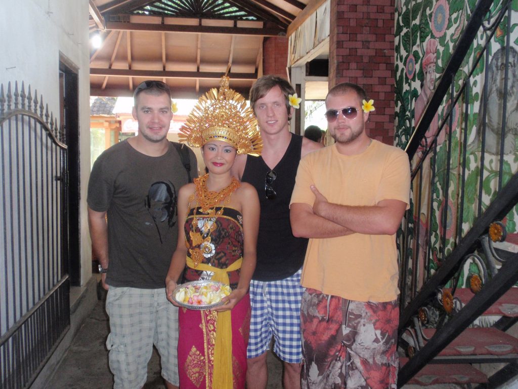 David Simpson with two guys and a girl in native costume in Bali. My first taste of Asia