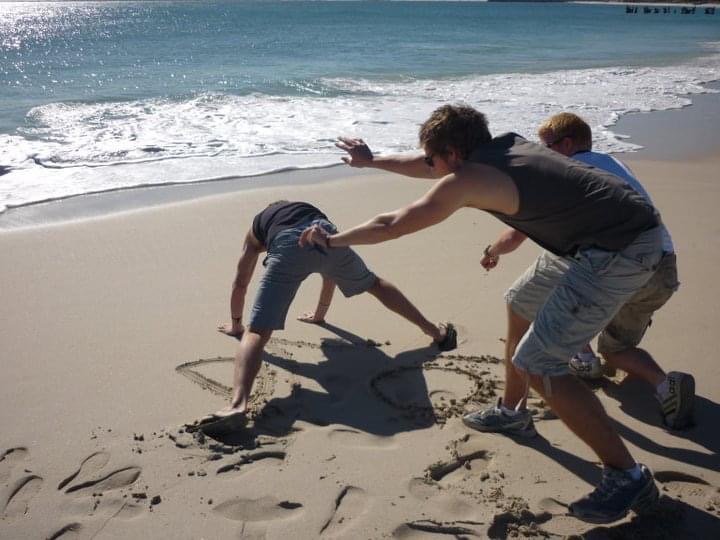 David Simpson and three guys having fun at the beach in West Coast, Australia. Hitting a cow on the west coast road trip