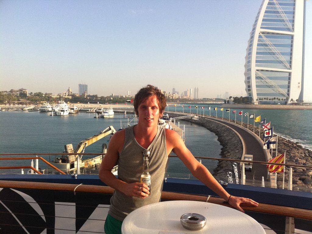 David Simpson drinking beer with Burj Al Arab backdrop in Dubai. Staying on the palm in Dubai