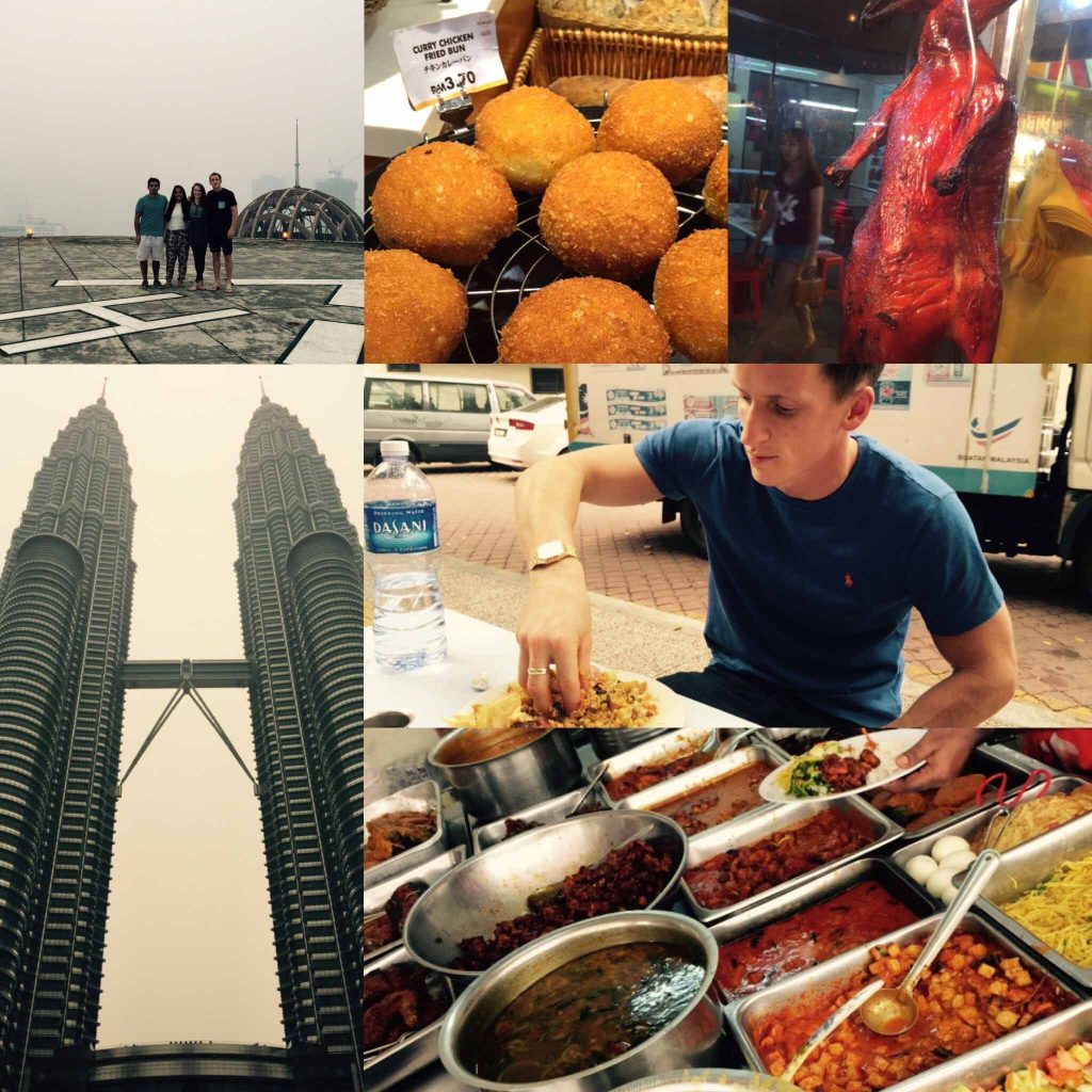 David Simpson eating with bare hands, assorted Asian dishes, Petronas towers, street food and smog in Malaysia. My first day in South East Asia