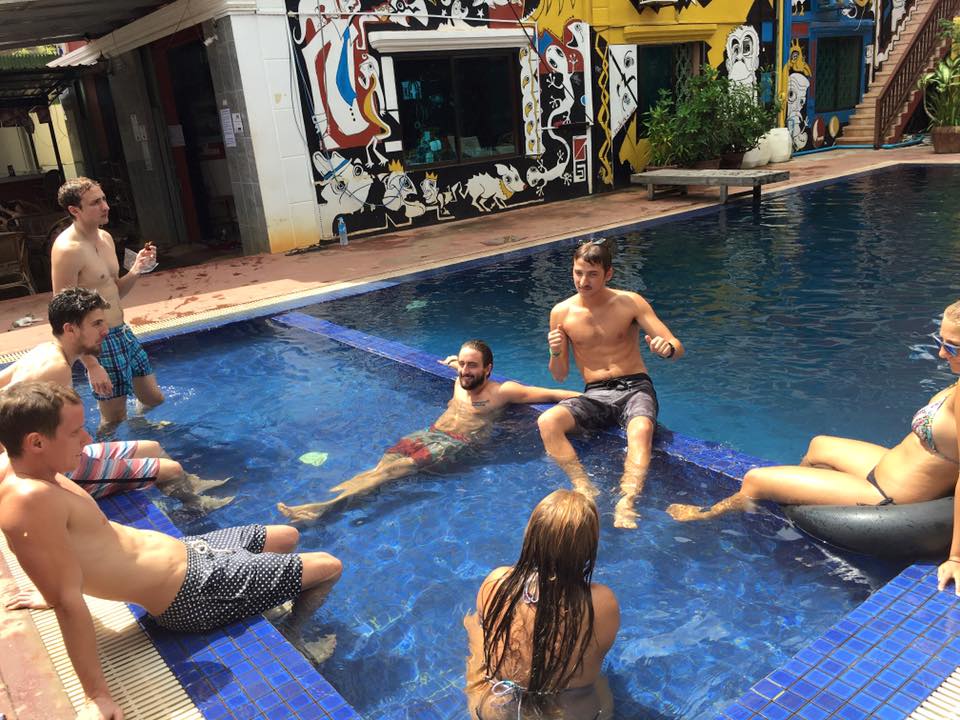 Swimming in the pool in Siem Reap hostel in Cambodia. Pub crawls and eating spiders in Siem Reap