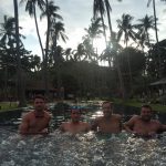 David Simpson with three guys in the pool in Thailand. New years full moon party