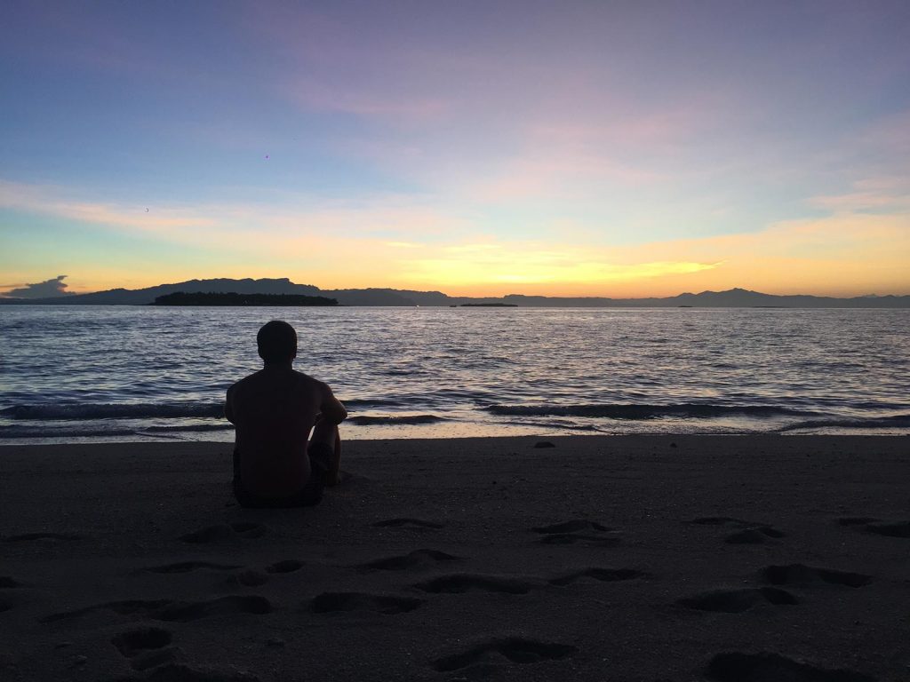 David Simpson at sunset in Beachcomber Island, Fiji. Beachcomber island