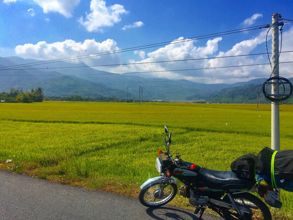 Motorbike by the rice fields in Da Lat, Vietnam. Night rider and a broken bike