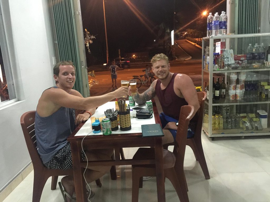 David Simpson and friend drinking in Hue, Vietnam. Crashing twice and friendly locals