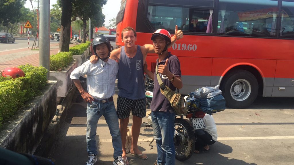 David Simpson with the locals in Hue, Vietnam. Crashing twice and friendly locals
