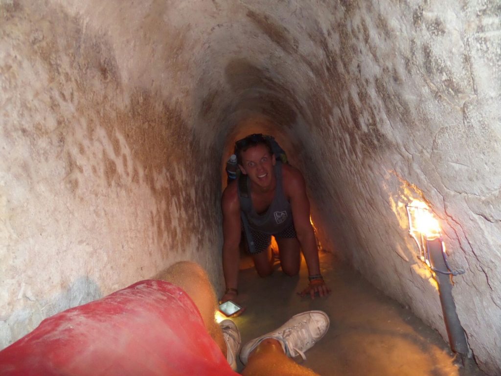 David Simpson and friend inside a tunnel in Ho Chi Minh, Vietnam. Stabbings & tunnels in Ho Chi Minh