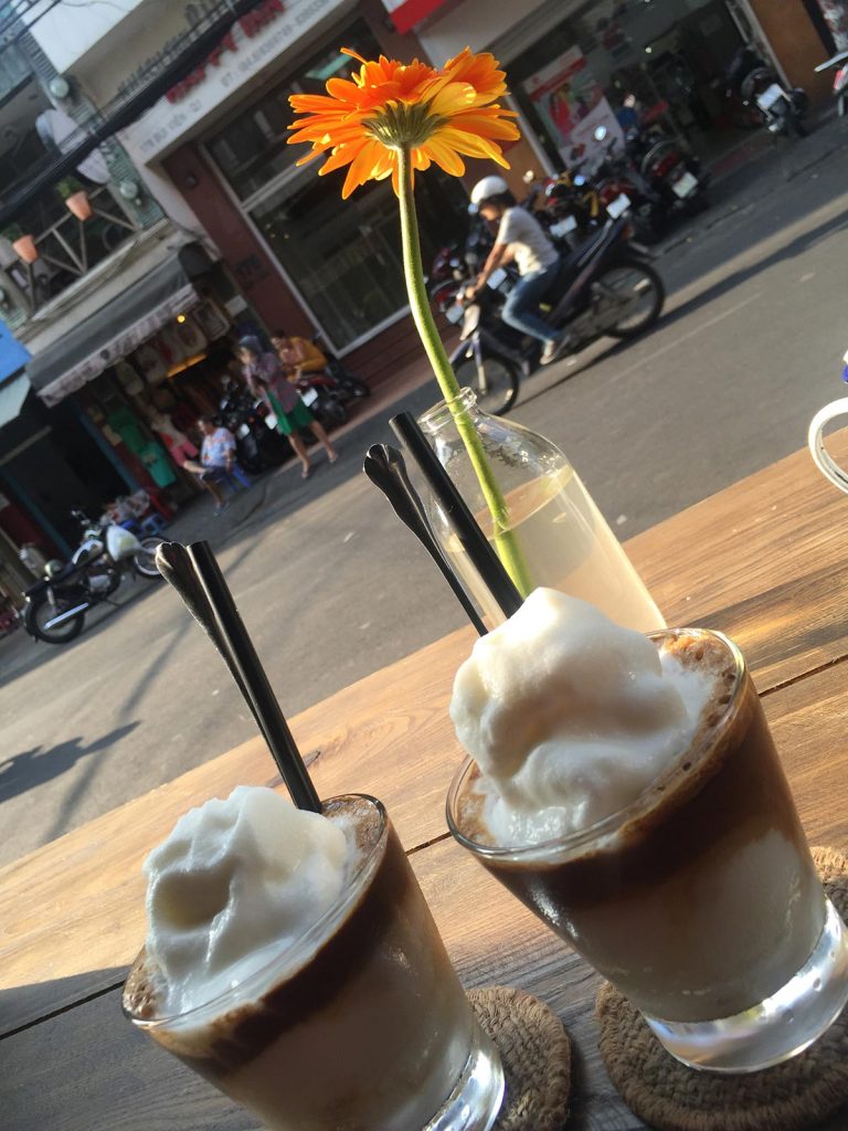Coconut smoothie and flower in Saigon, Vietnam. Stabbings & tunnels in Ho Chi Minh