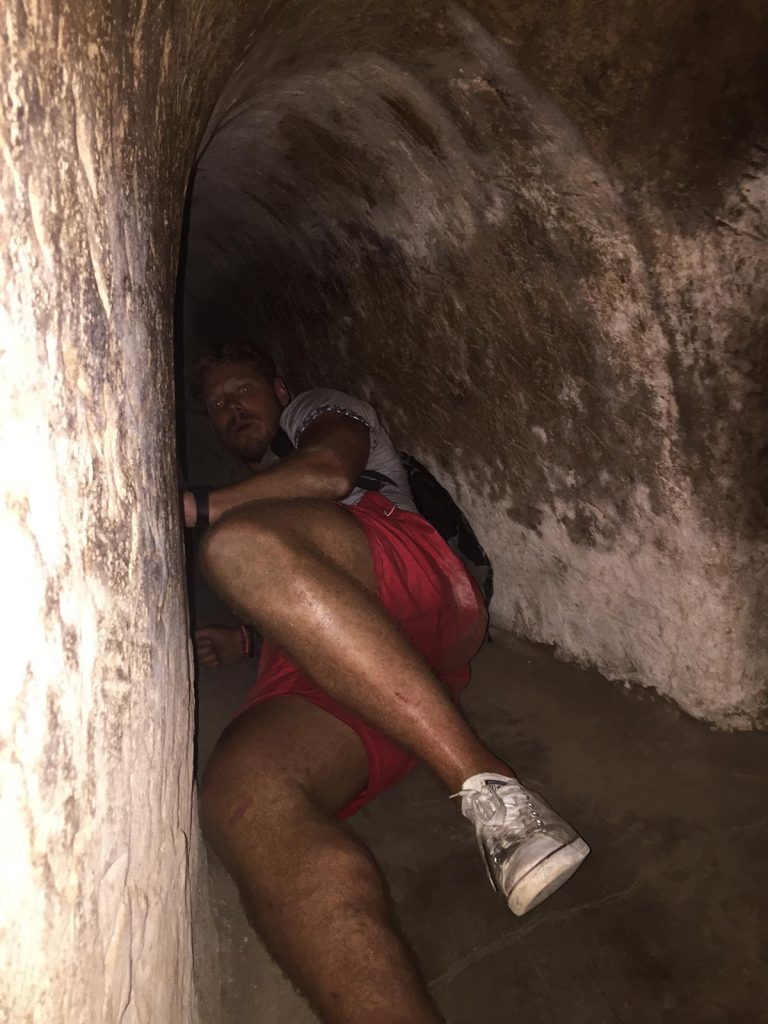 A friend inside a tunnel in Ho Chi Minh, Vietnam. Stabbings & tunnels in Ho Chi Minh