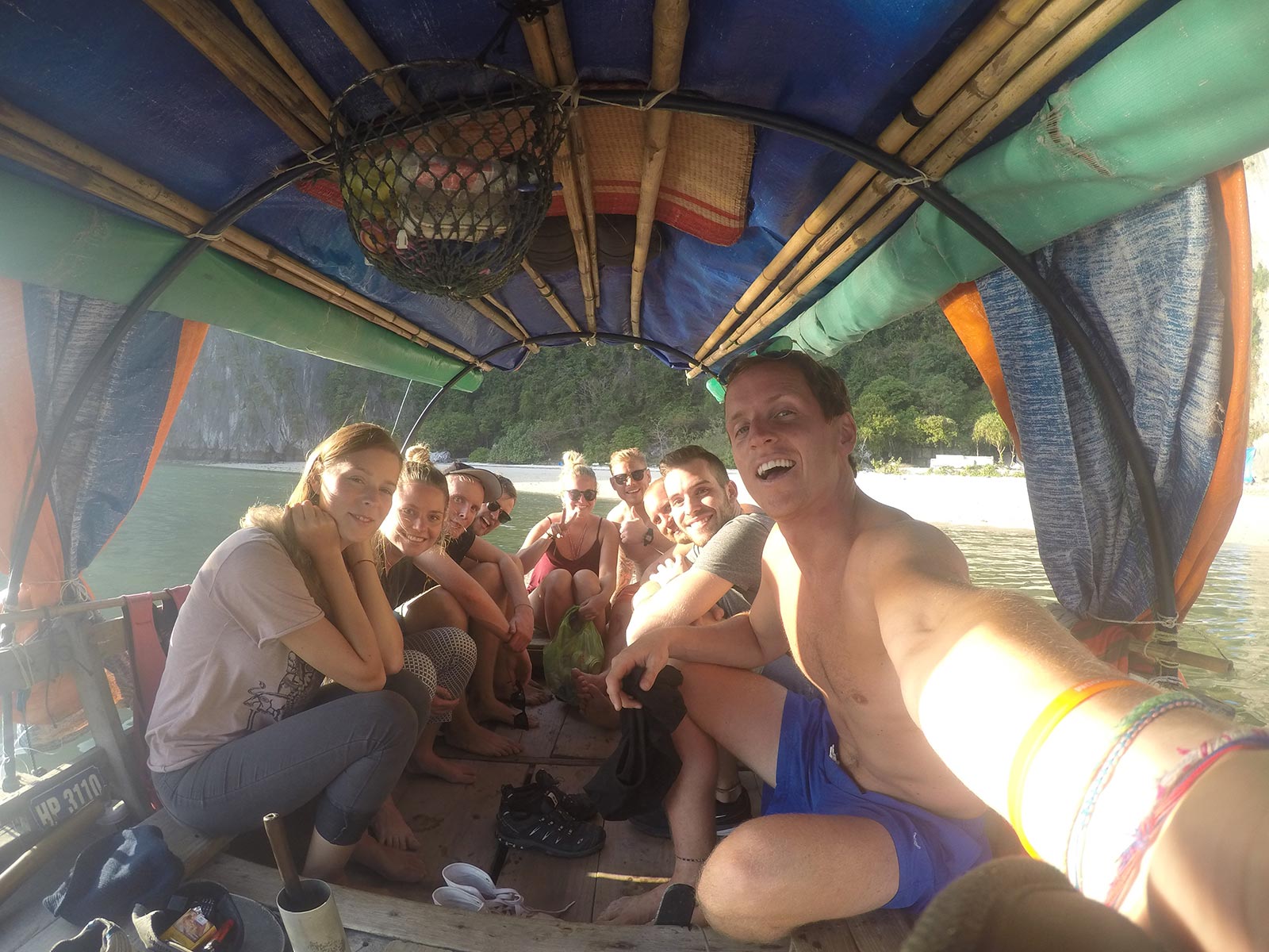 David Simpson and friends on a boat in Ha Long Bay, Vietnnam. Rock climbing in Ha Long Bay