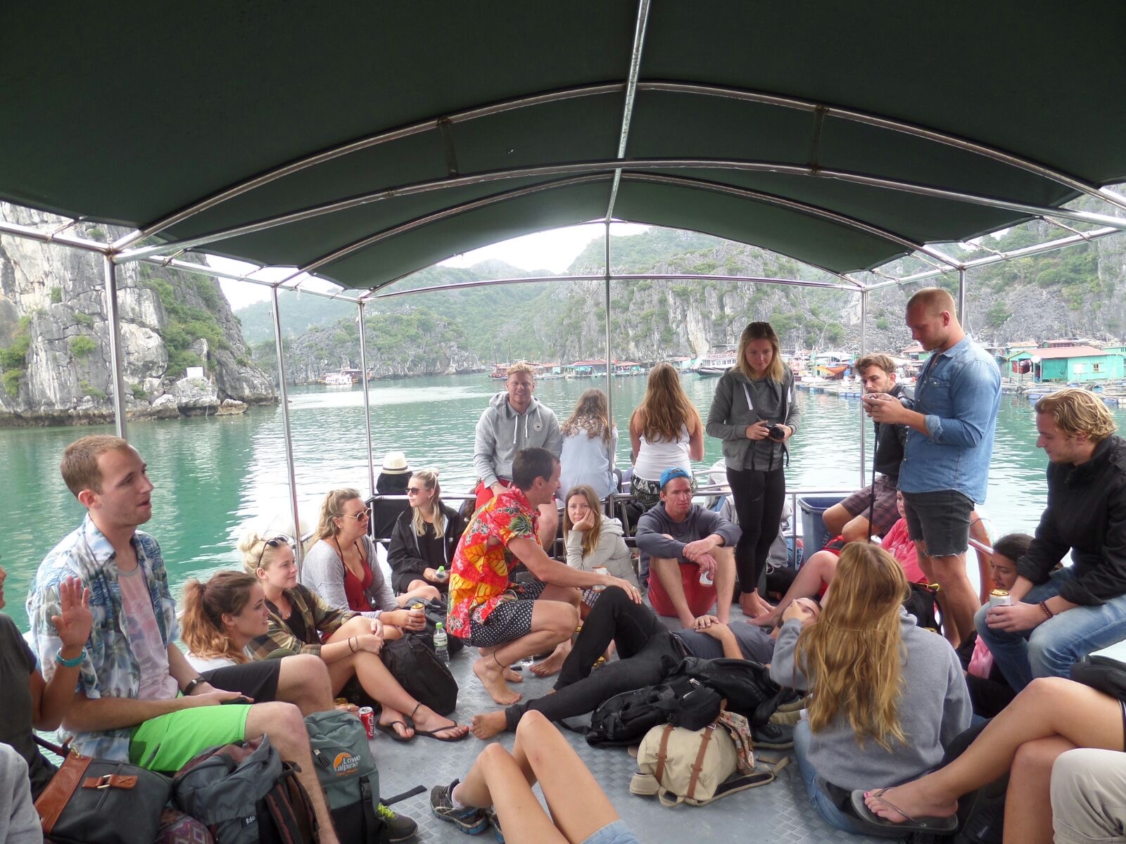 David Simpson and friends on a boat in Ha Long Bay, Vietnam. Wake boarding and back to Hanoi