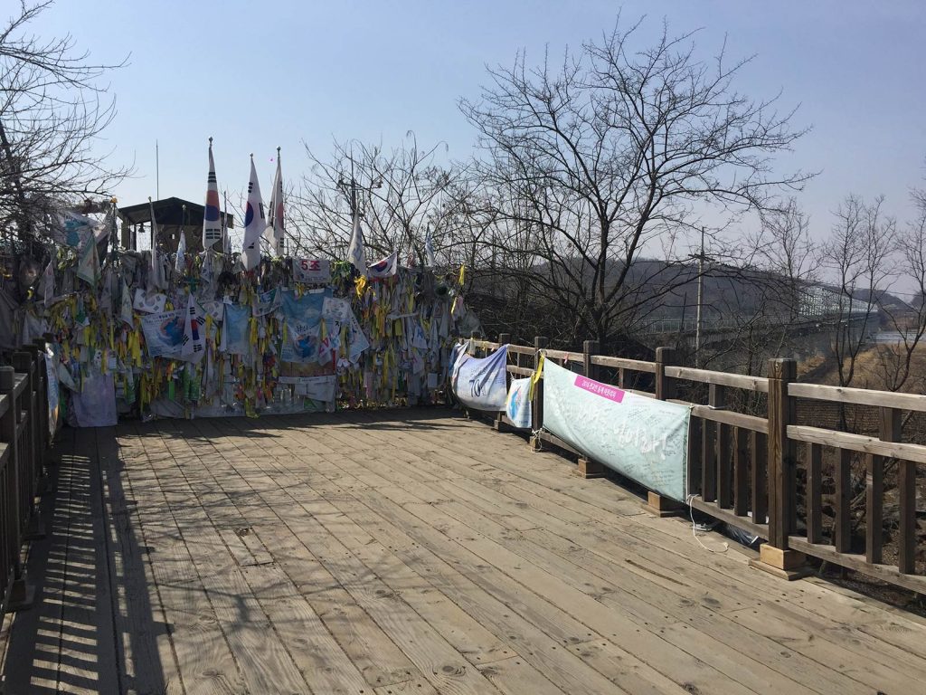 Road closed with propaganda flags in DMZ, South Korea. The DMZ