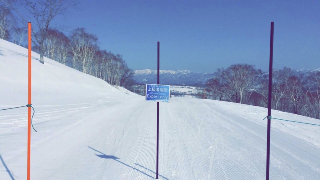 Warning sign in Niseko, Japan. Skiing & Snowmobiles in Niseko, Japan