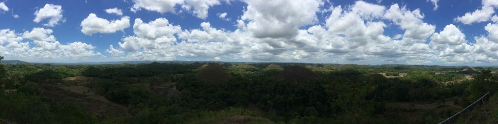 Clouds over Chocolate Hills in Bohol, Philippines. Alona Beach & Chocolate Hills