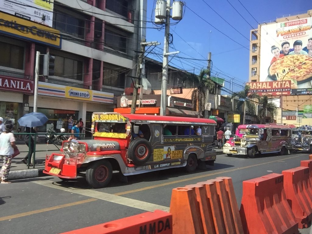 Jeepneys in streets of Manila, Philippines. A week at the Shangri-La Resort, Boracay
