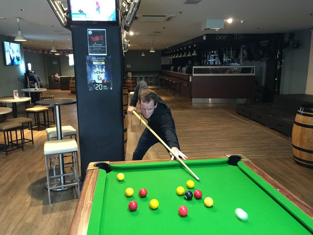 David Simpson playing billiards in Melbourne. Back to Melbourne