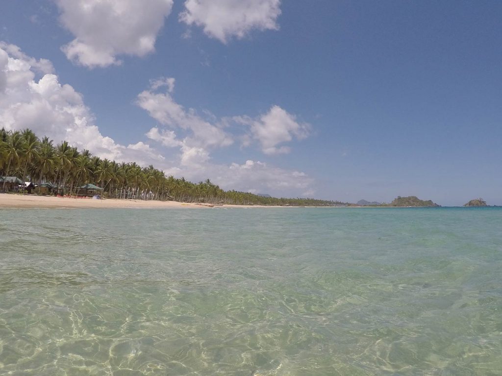 Clear beach water in Nacpan, Philippines. The best beach in the world all to myself