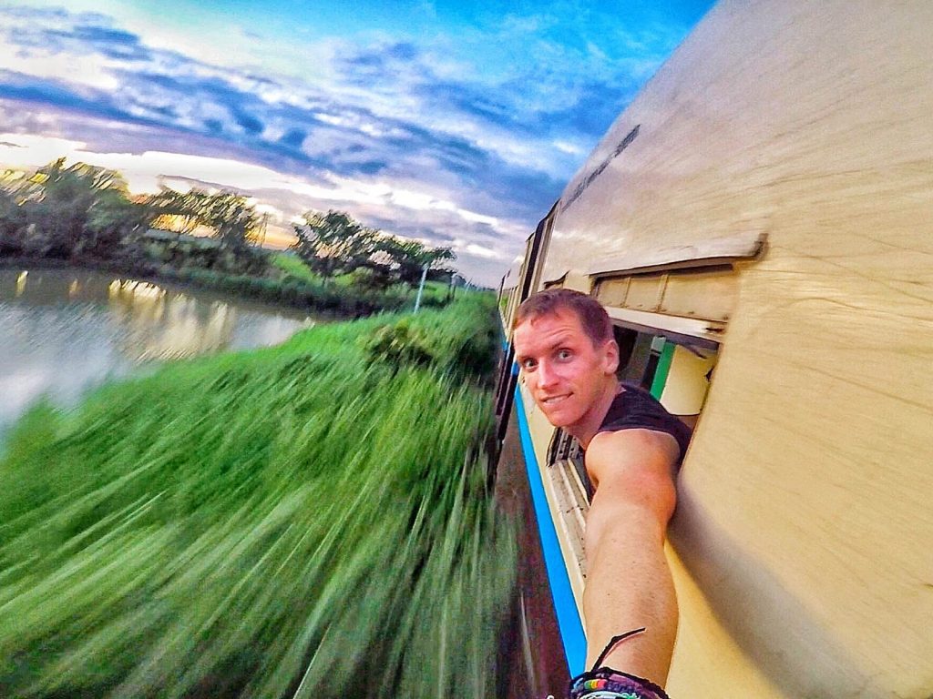 David Simpson sticking his head out of train in Bagan, Myanmar. Trains, temples & Bagan, The highlights of Myanmar