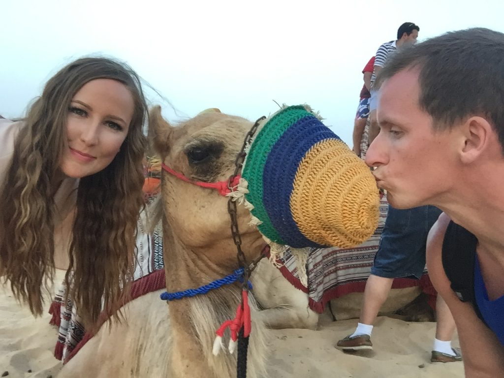 David Simpson and friend girl with camel at desert in Dubai, UAE. Safaris in Dubai & waffles in Brussels