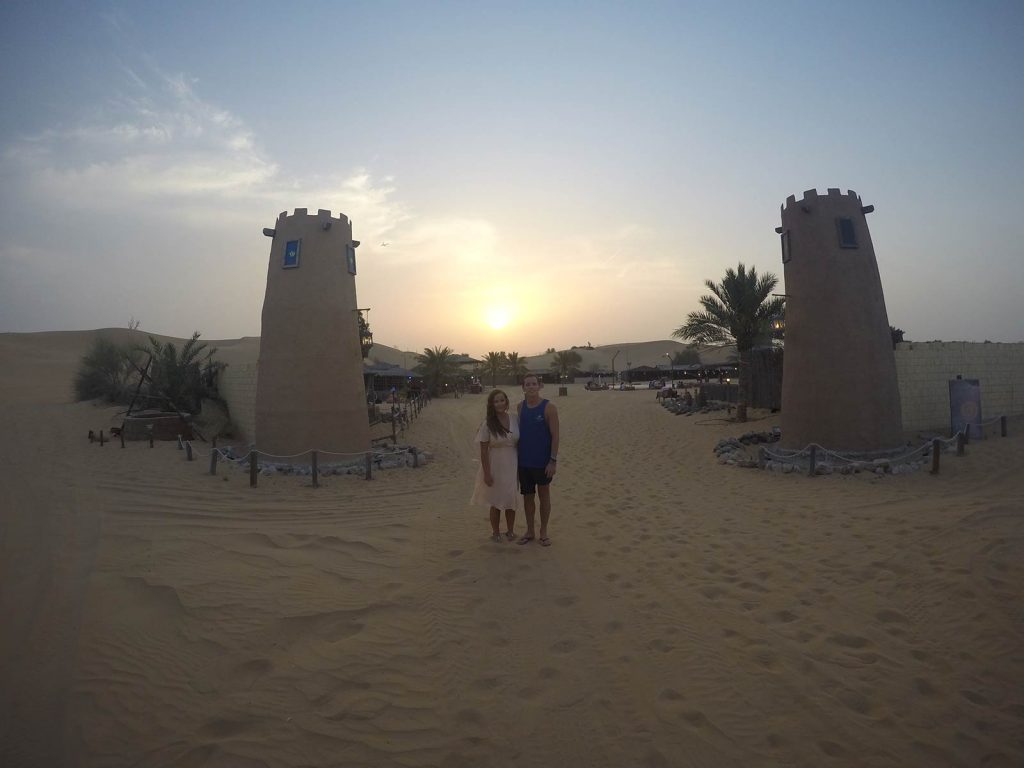 David Simpson and friend girl at desert sunset in Dubai, UAE. Safaris in Dubai & waffles in Brussels