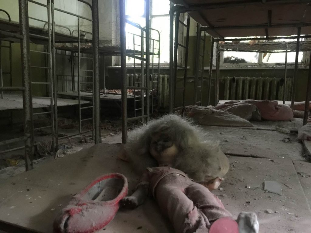 Abandoned doll, shoe and bunkbeds at Pripyat in Chernobyl, Ukraine. The most dangerous attraction on earth