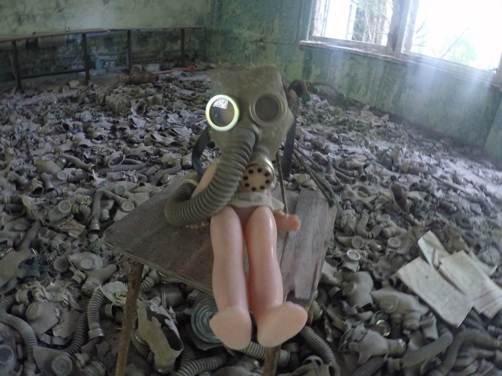 Doll wearing gas mask at Pripyat in Chernobyl, Ukraine. The most dangerous attraction on earth