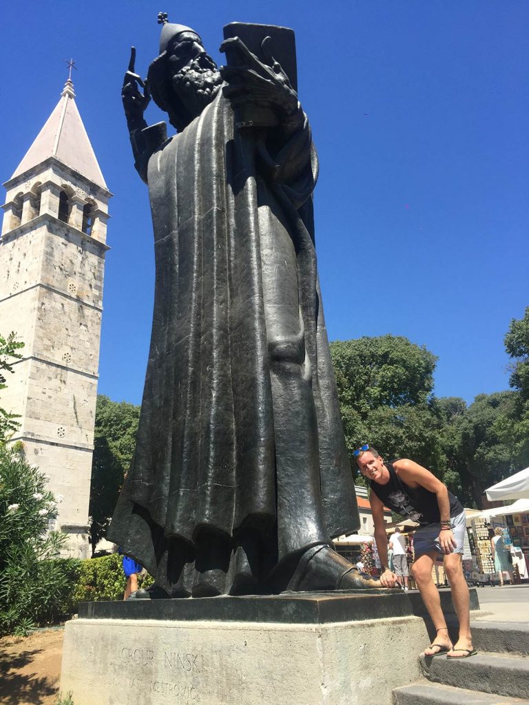 David Simpson near tall, black statue in Split, Croatia. My Balkans trip summed up in photos