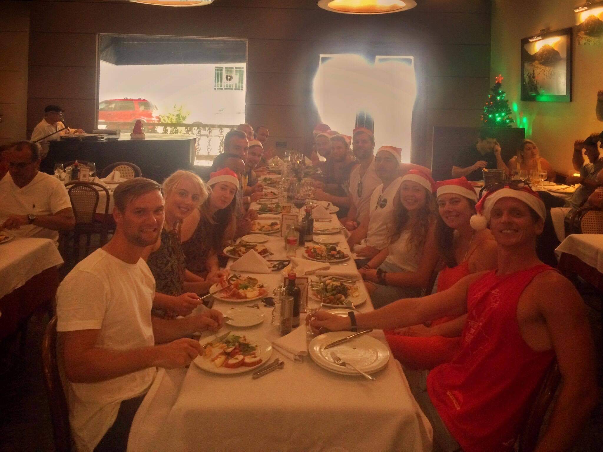 David Simpson and friends eating Christmas lunch in Rio de Janeiro, Brazil. Friends, steak & Copacabana, a perfect Christmas in Rio
