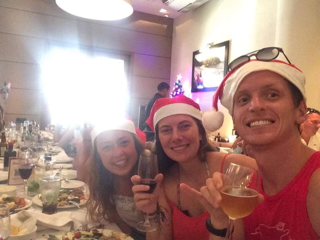 David Simpson and friends eating Christmas lunch in Rio de Janeiro, Brazil. Friends, steak & Copacabana, a perfect Christmas in Rio
