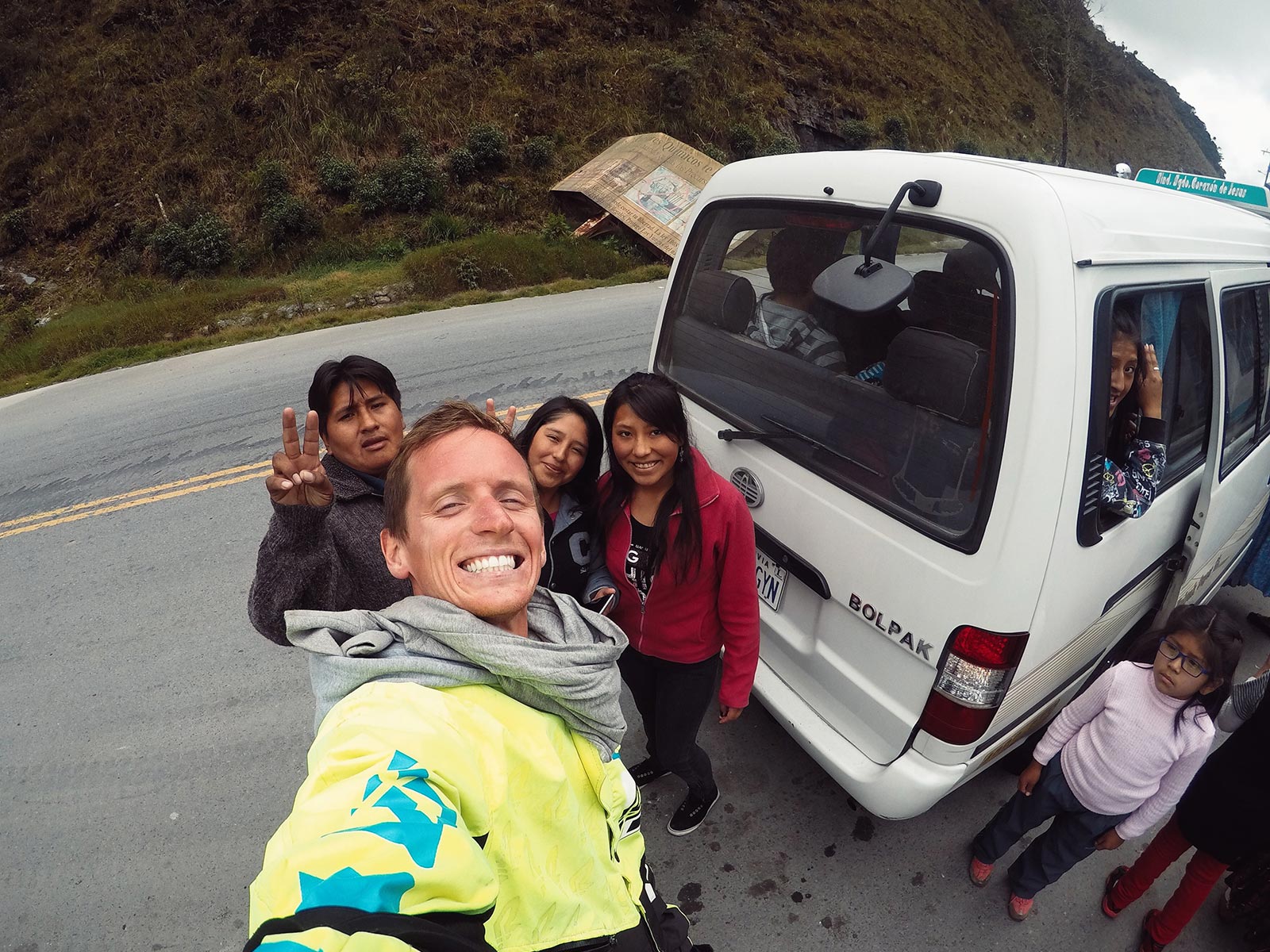 David Simpson with locals in a van in Bolivia. Cycling Death Road & Full Guide
