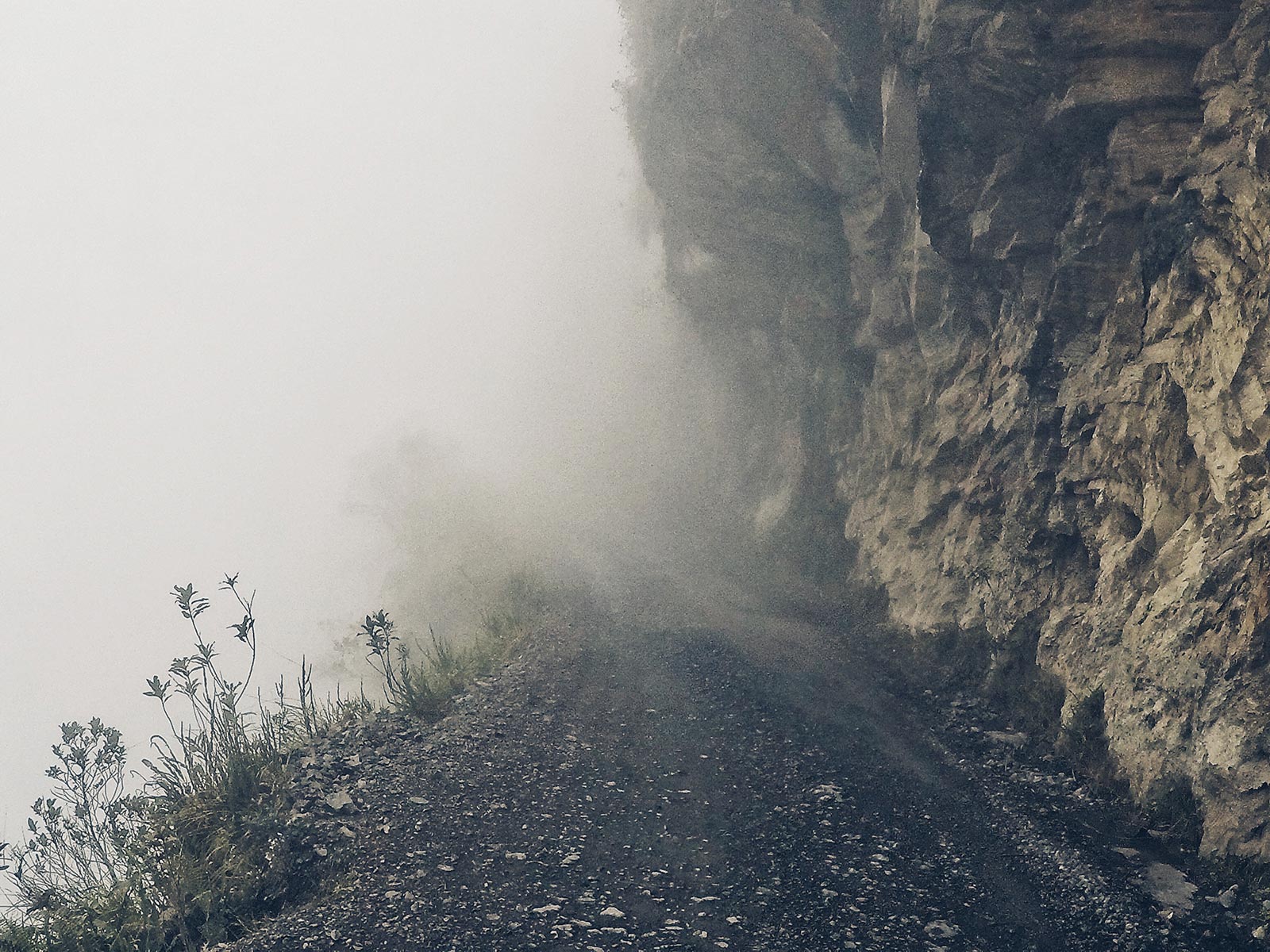 Foggy road while cycling Death Road in Bolivia. Cycling Death Road & Full Guide