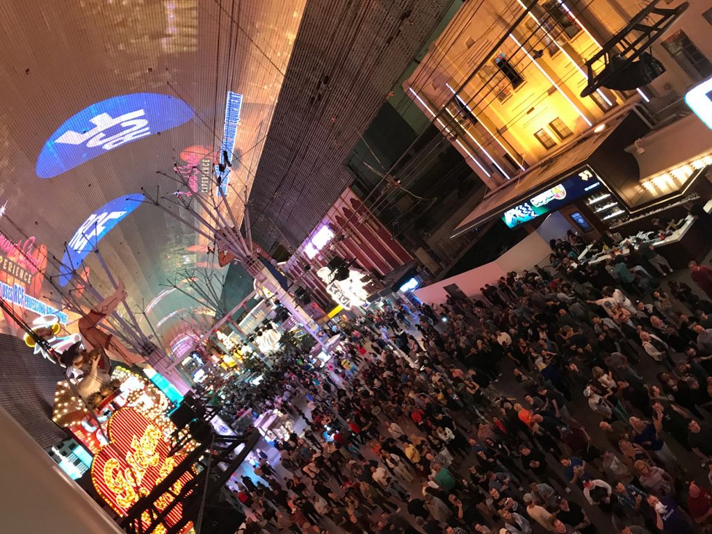 Crowd of people at Fremont Street in Las Vegas, USA. Helicopter tour over the Grand Canyon
