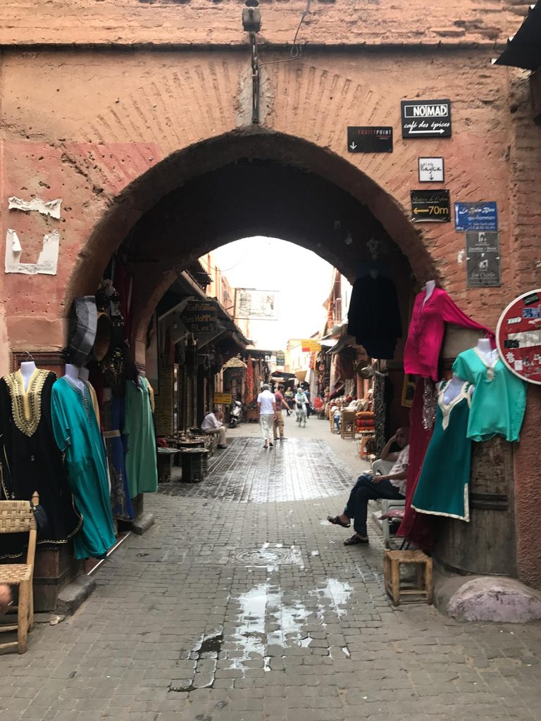 Shops in Marrakesh, Morocco. Being attacked by a man with a snake