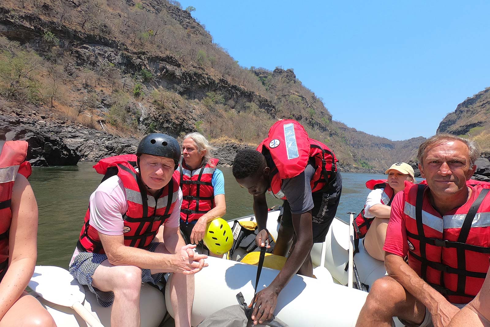 Dad and companions at Victoria Falls white water rafting in Zimbabwe, Africa. A bloodied nose, cracked rib and saving a life