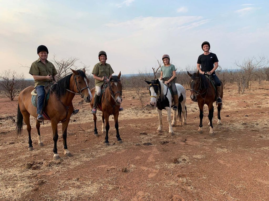 David Simpson and family on horseback safari in Zimbabwe, Africa. Horseback safari in Zimbabwe