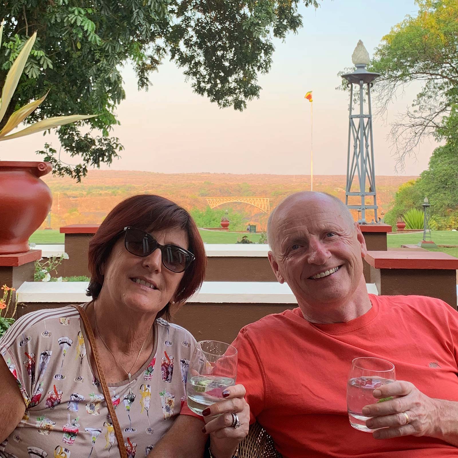 Mom and Dad having drinks in Zimbabwe, Africa. A bloodied nose, cracked rib and saving a life