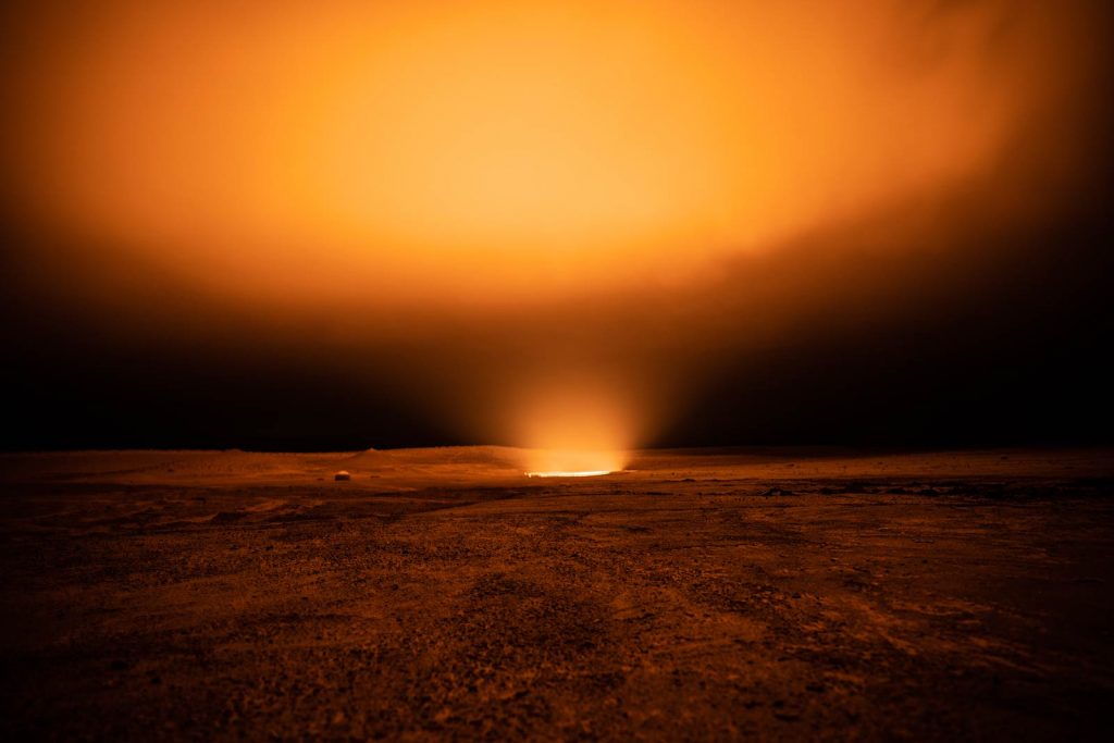 The gas crater glowing at night in Darvaza, Turkmenistan. The gates of hell
