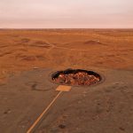 Birds eye view of the Gates to Hell in Darvaza, Turkmenistan. Gates to hell, visa disappointment & the worst steak in the world