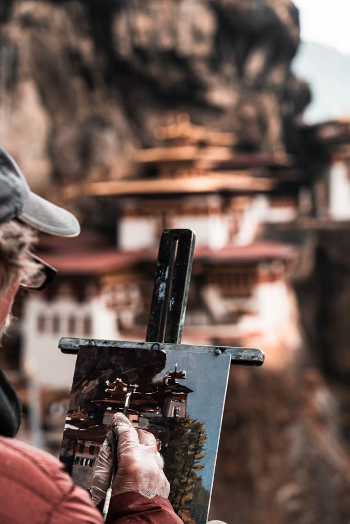 Artist painting the Tiger's Nest in Bhutan. The Central Asian series, reflection post