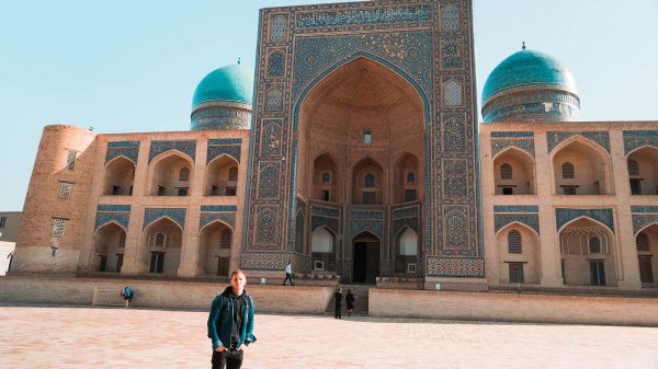 David Simpson and Mir-i-Arab Madrasa in Bukhara, Uzbekistan. A day in Bukhara, the highlight of Uzbekistan