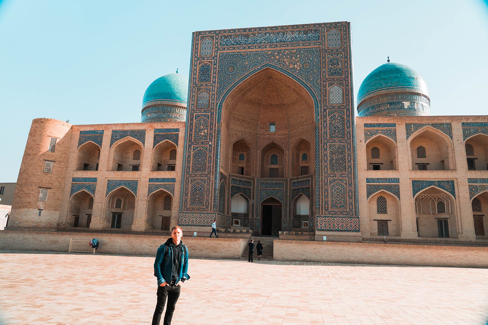 David Simpson and Mir-i-Arab Madrasa in Bukhara, Uzbekistan. A day in Bukhara, the highlight of Uzbekistan