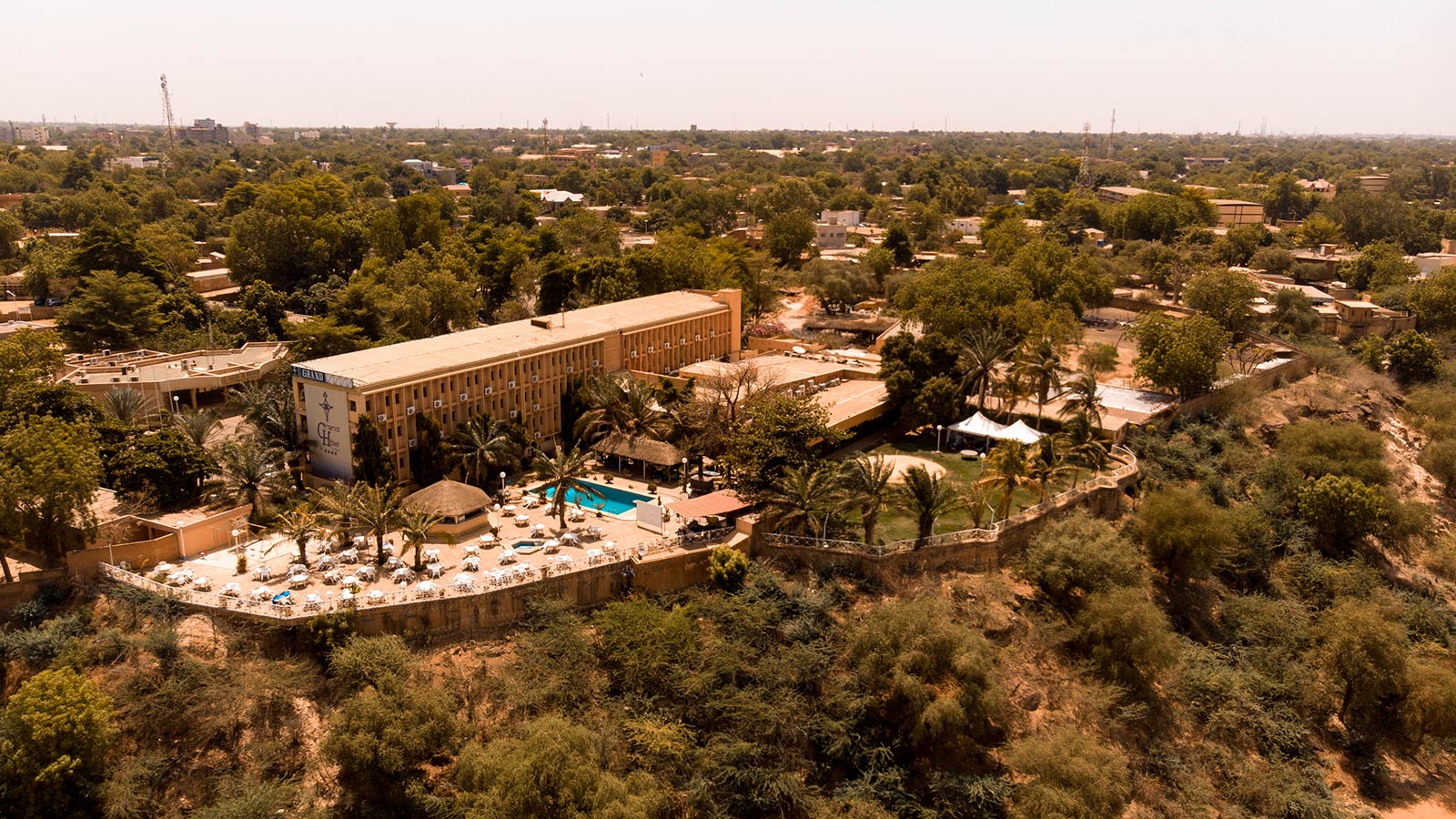 Birds eye view of hotel in Niger. Negotiating with taxi drivers in Niger