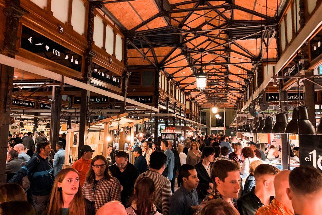 People at Mercado de San Miguel in Madrid, Spain. Chasing a tour bus around Madrid