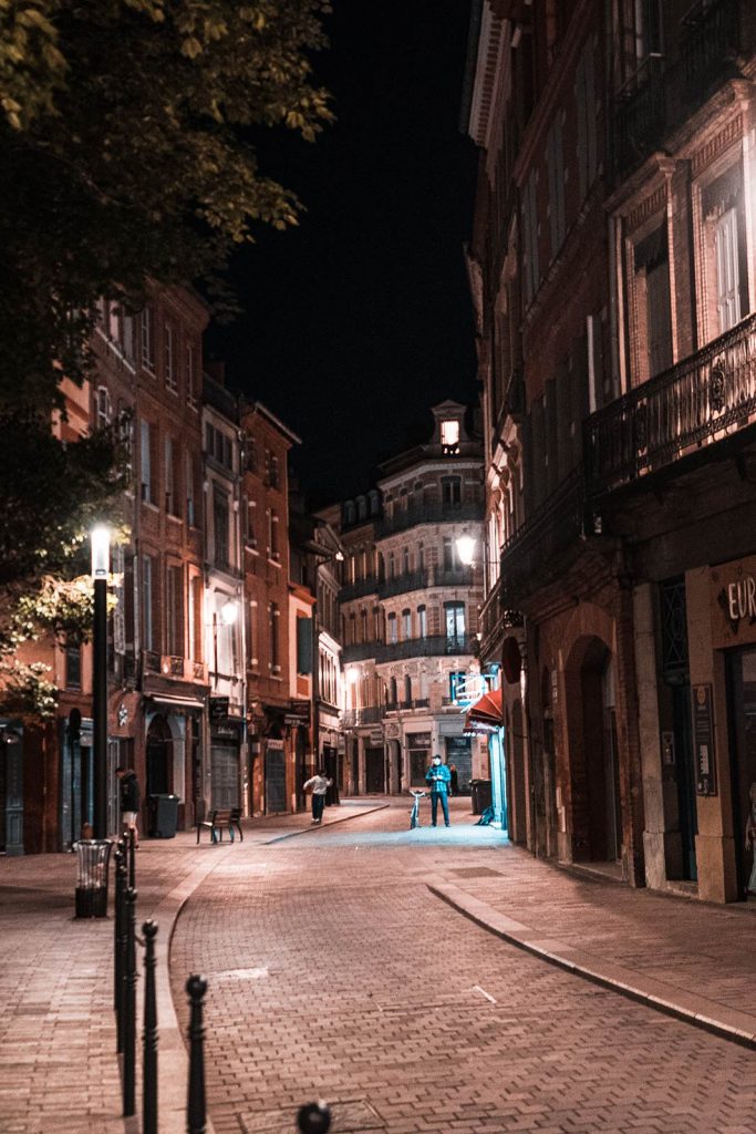 Street at night in Toulouse, France. The greatest buskers ever